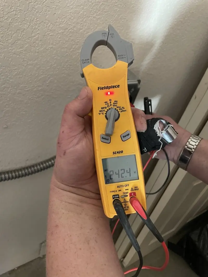 Voltage testing with clamp meter during Ceiling Fan Installation in New Port Richey East
